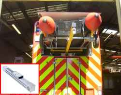 Fully inflated life raft is deployed by sealed belt drive