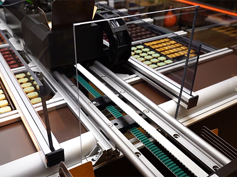 Plug-and-play linear motion turns a compact robot into a multitasking chocolate picker