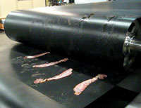 Cleaner cooking with steel belts